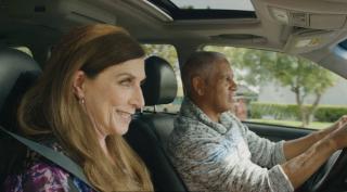 a photo of an older woman and man in a car